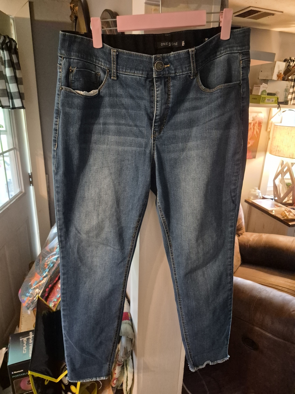are One5One brand mid-rise blue jeans with a raw hem ankle crop